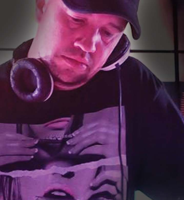 Kevin Allen performing with headphones around his neck